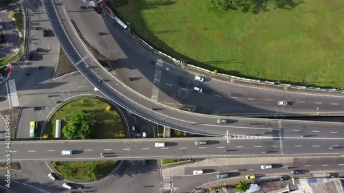 Timelapse drone footage of top view of Highway road junctions. The Intersecting freeway road overpass the eastern outer ring road of Yogyakarta Indonesia photo