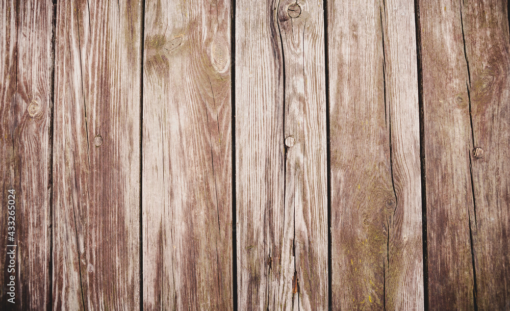 Naklejka premium Wooden texture background. Teak wood. Beautiful backgrounds of boards in which there are nails, old lumber, a fence of their strong wood