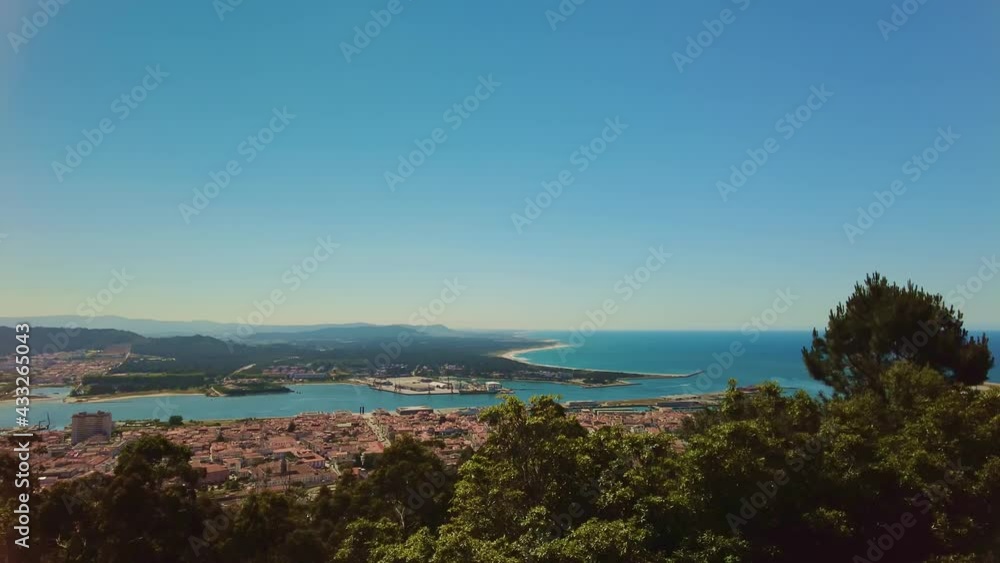 Panorama landscape of Viana do Castelo, Portugal. Aerial view of the city on the Atlantic ocean. Panning of the river flowing into the ocean. Urban background Panorama landscape of Viana do Castelo, Portugal. Aerial view of the city on the Atlantic ocean. Panning of the river flowing into the ocean. Urban background