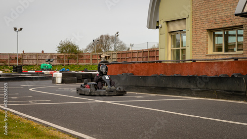 A shot of a racing kart as it circuits a track.