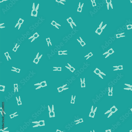 Green Old wood clothes pin icon isolated seamless pattern on green background. Clothes peg. Vector