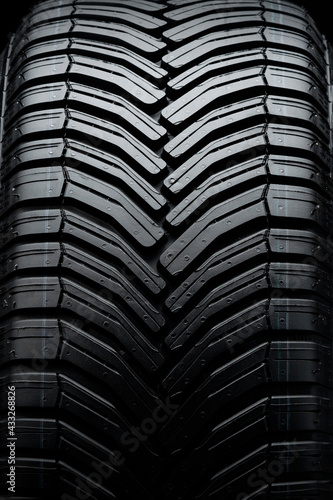 directional tire protector close-up, black rubber background photo