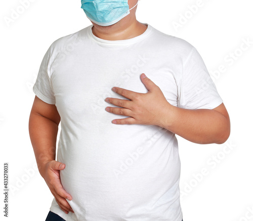 Wallpaper Mural Fat man wearing a mask Chest pain, trouble breathing Are at risk of developing diabetes Hypertension Coronary heart disease Hyperlipidemia The risk of coronavirus. White background. Clipping Path Torontodigital.ca