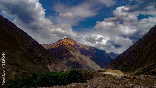 clouds over the mountains, beautiful mountains of Pakistan, blue sky with mountains, rocks, 