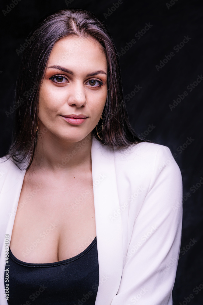 Portrait of woman in studio. Smiling mysterious brunette girl Portrait of woman in studio. Smiling mysterious brunette girl