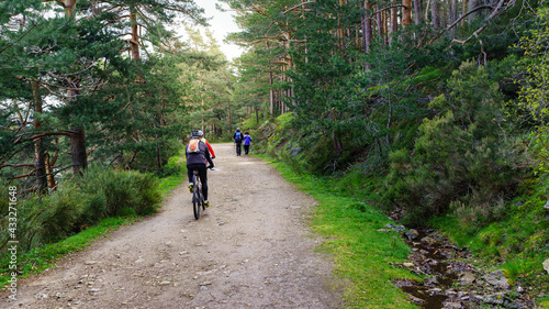 Path in the forest for sports, people cycling and hiking. Guadarrama Madrid.