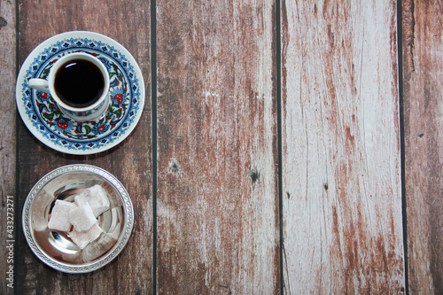 black turkish coffee in a mug and sweet lukum