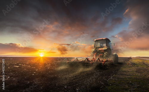 Landscape fantastic sunset on the wheat field