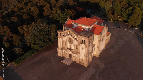 DRONE AERIAL VIEW: Facade of the church of Nossa Senhora da Assuncao (Our Lady of Assumption) in the hill of Monte Cordoba at sunset in Santo Tirso, Portugal.