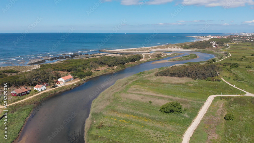 DRONE AERIAL VIEW: The mouth and estuary of Neiva River in Castelo do Neiva, Viana do Castelo, Portugal. DRONE AERIAL VIEW: The mouth and estuary of Neiva River in Castelo do Neiva, Viana do Castelo, Portugal.
