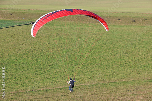 Paraglider flying at Milk Hill, Wiltshire 