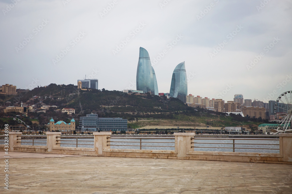 View from The Caspian Sea to Flame Towers. Baku Flame Towers is the tallest skyscraper in Baku, Azerbaijan