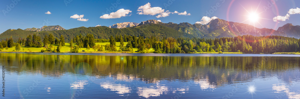 panoramic landscape with alps mountain range at springtime panoramic landscape with alps mountain range at springtime