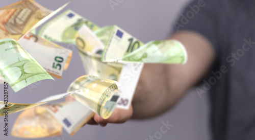 banking euro banknote in hand rain