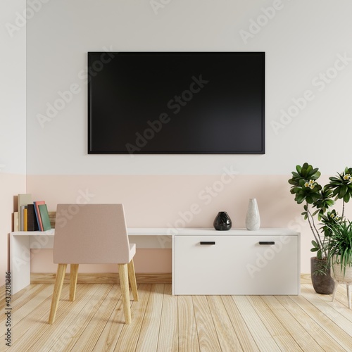 TV on the white and cream wall in the living room with books and vases on the table and the armchairs and trees on the wooden floor.3d rendering. © redrabbit007