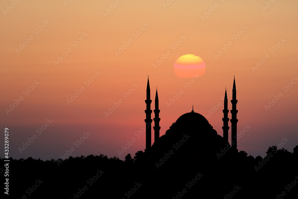 mosque silhouette in front of sunset background. Front view