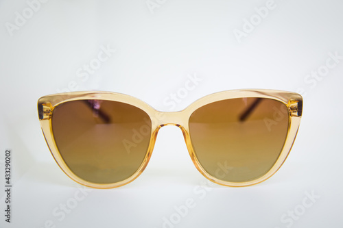Sunglasses isolated, cutout . Modern brown sunglasses isolated on white background . Sun eyeglasses close up isolated on white background . Elegant sunglasses isolated on the white .
