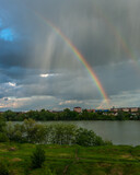 clouds, rain and rainbow over the Kuban river near the city of Krasnodar on a spring rainy day