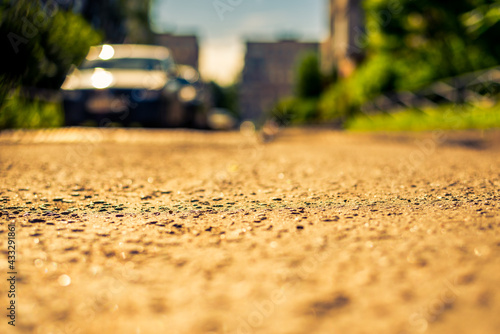 Wallpaper Mural Sunny day in a city, road in city courtyard with parked cars. View from the asphalt level Torontodigital.ca