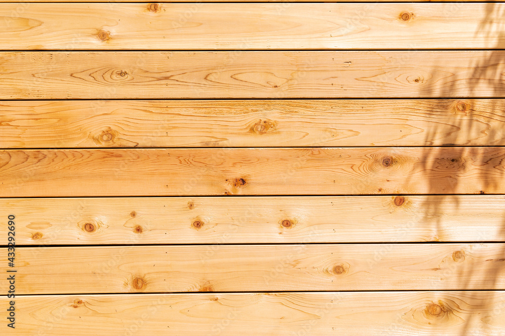 Fresh wood softwood wall made of horizontal boards. Fresh wood softwood wall made of horizontal boards.
