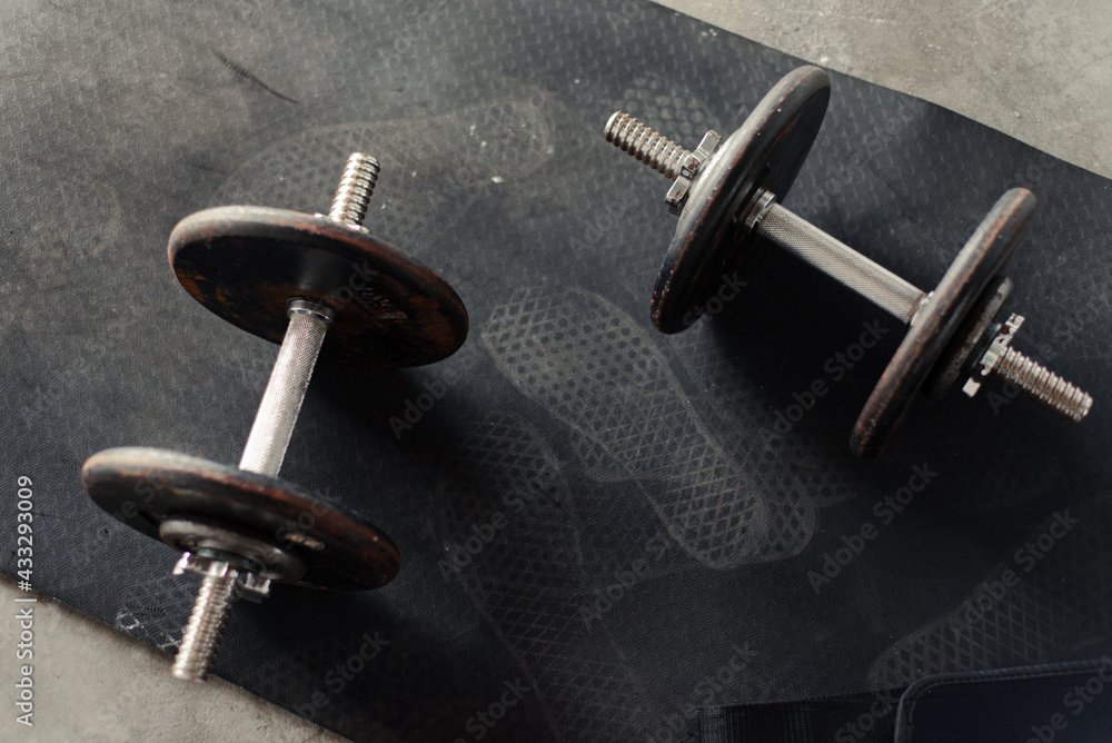 dumbbells and workout equipment in home garage dumbbells and workout equipment in home garage