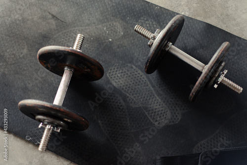 dumbbells and workout equipment in home garage