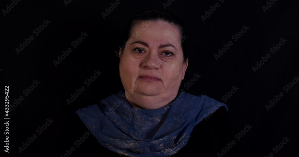 Older woman opens up her eyes and stares Older woman opens up her eyes and stares