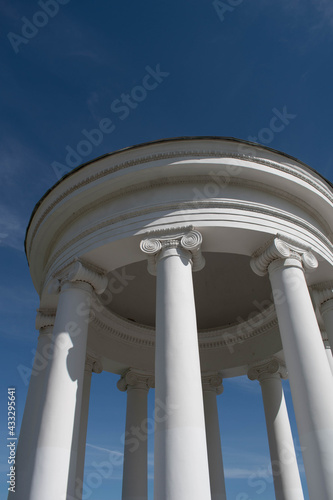 Columns. This photo can be used to show an example of ancient structures, to show the contrast of buildings and the bright blue sky. It will be the perfect background for your desktop.