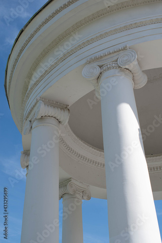 Columns. This photo can be used to show an example of ancient structures, to show the contrast of buildings and the bright blue sky. It will be the perfect background for your desktop.