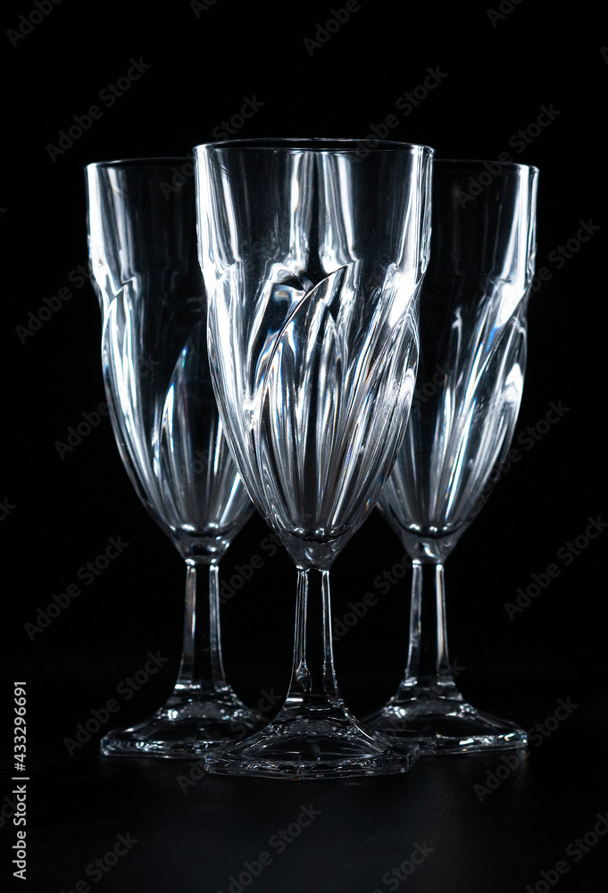three empty wine glasses on black background three empty wine glasses on black background