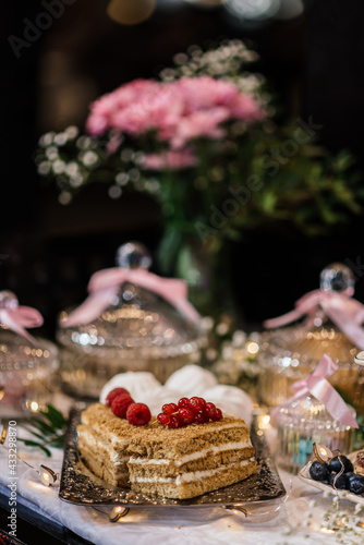 cakes on a silver tray. out of focus background