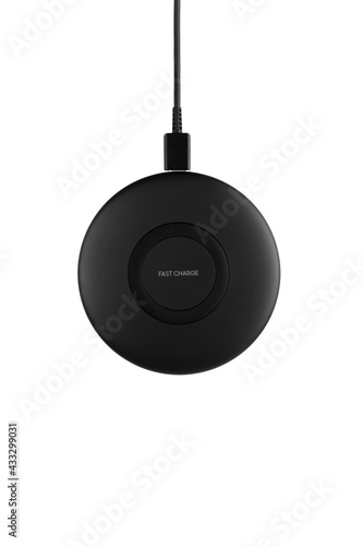 Wireless charging for a smartphone on a white background. Fast wireless charger close-up.Top View.