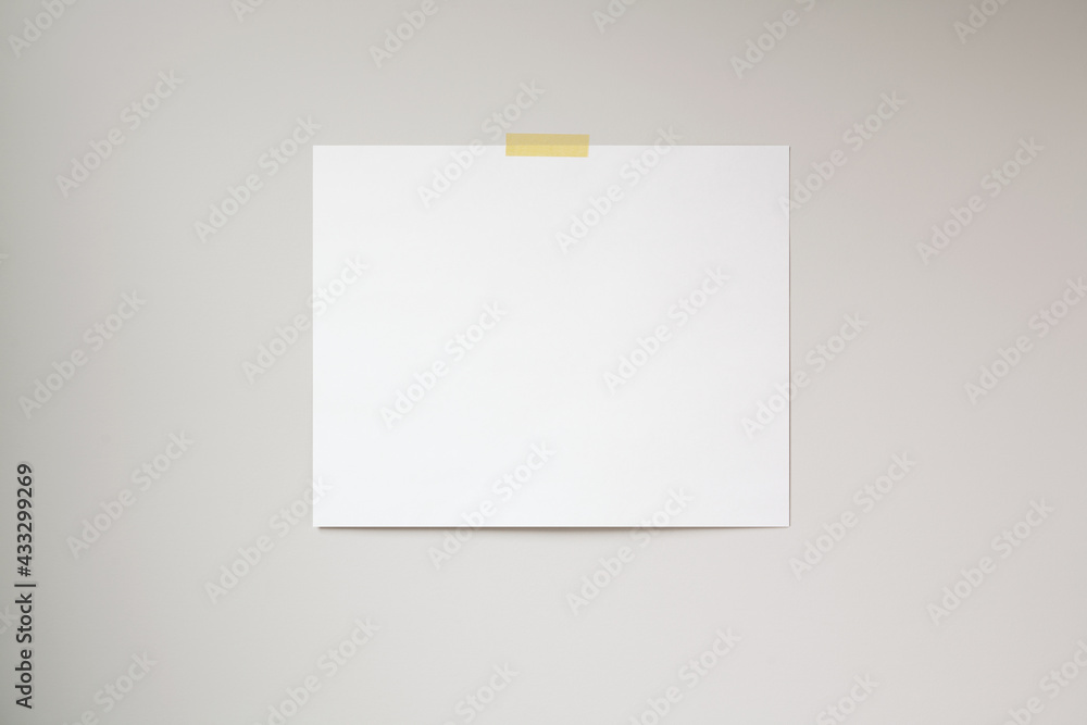 Horizontal poster mockup taped to a neutral coloured wall. 4:5 aspect ratio poster. Horizontal poster mockup taped to a neutral coloured wall. 4:5 aspect ratio poster.