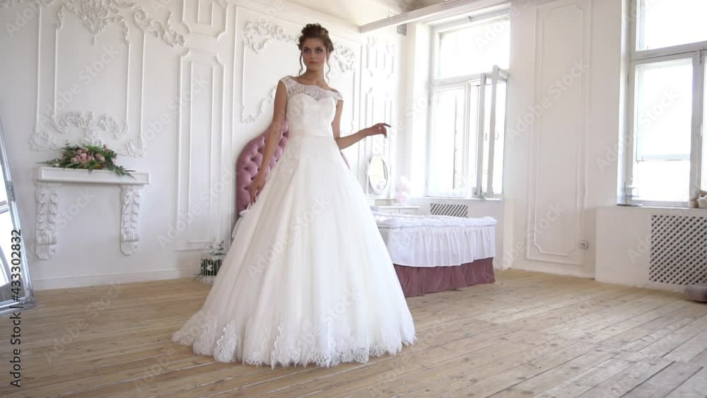 Young Beautiful Bride In Wedding Dress In The Hotel Slow Motion Young Beautiful Bride In Wedding Dress In The Hotel Slow Motion