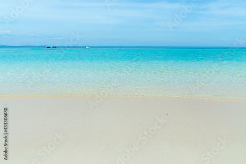 Soft blue ocean wave on clean sandy beach  © กรบุรษ วรดี