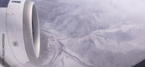 Winter mountains from the plane window photo