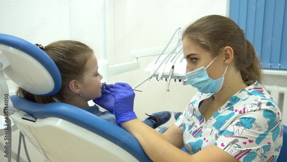 Slow Motion A child with a dentist in a dental office. Slow Motion A child with a dentist in a dental office.