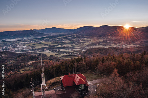 Photography morning force of the sun awakens the landscape to life on Velky Ondrejnik mountain in the south of Beskydy mountains, Czech Republic