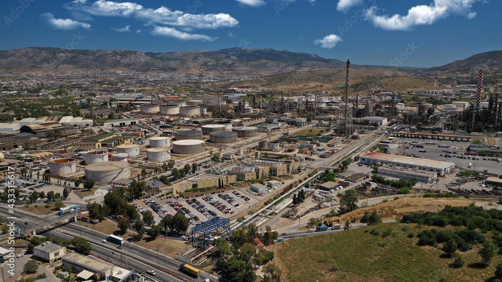 Fototapeta premium Aerial drone photo of industrial public Hellenic Petroleum refinery in area and bay of Aspropirgos, Attica, Greece