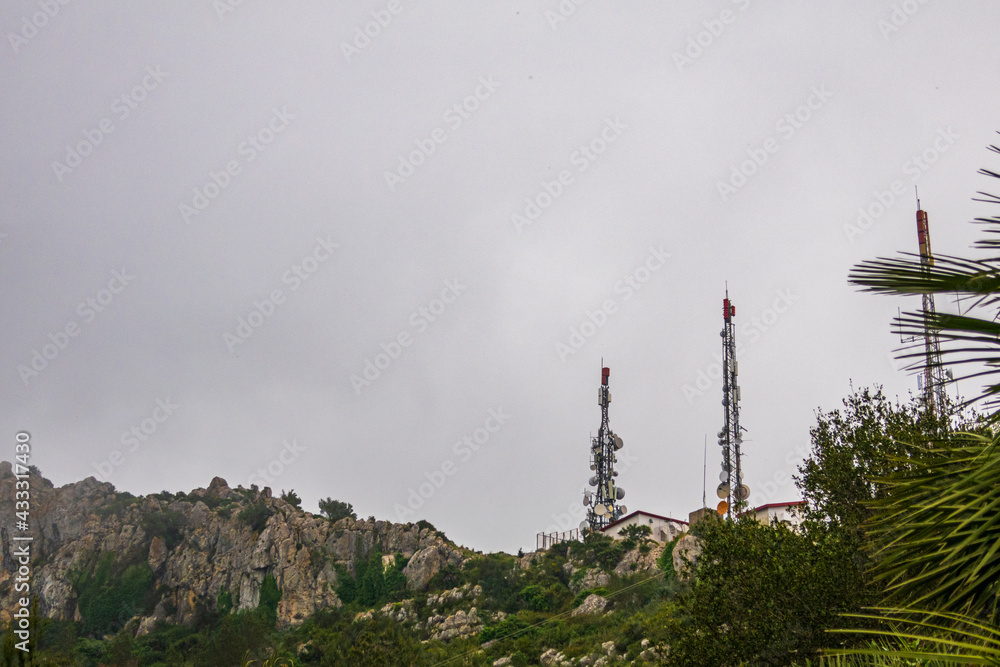 Telecommunication antennas, on Mount Segaria in Alicante (Spain), on a foggy and cloudy morning.
