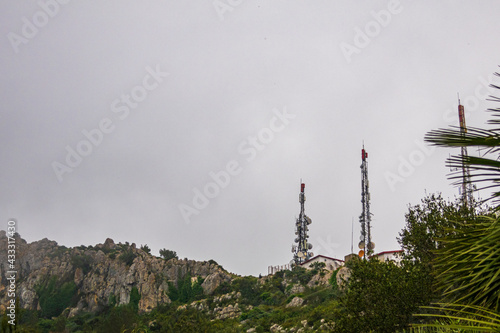 Obraz na płótnie Telecommunication antennas, on Mount Segaria in Alicante (Spain), on a foggy and cloudy morning. w salonie