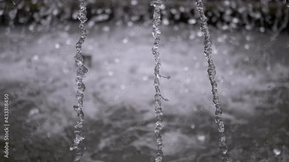 Water Jets from City Fountain in the Park. Water head and pressure. Water drops fall in the bowl of fountain. Splashes of water. Slow motion. Close up. 180 fps. Water Jets from City Fountain in the Park. Water head and pressure. Water drops fall in the bowl of fountain. Splashes of water. Slow motion. Close up. 180 fps.