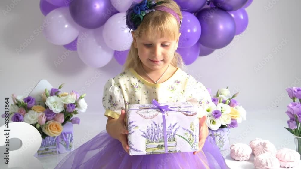 Slow Motion Cute funny baby girl year play with gift box. Birthday party Slow Motion Cute funny baby girl year play with gift box. Birthday party