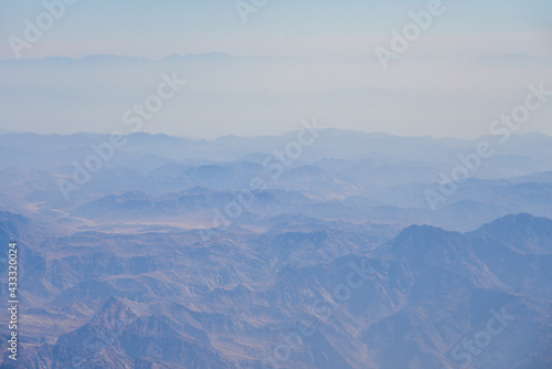 The tops of the desert mountains in the fog