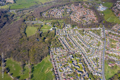 Aerial photo of the British town of Meanwood in Leeds West Yorkshire showing typical UK housing estates and rows of houses from above in the spring time on a sunny day photo