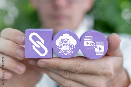 Businessman holding polystyrene foam blocks with chain and web icons. Internet Link Hyperlink Concept.