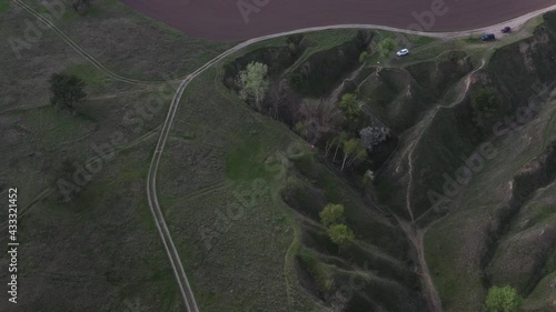 road bend, paths between desert field and forest, landscape top view, dynamic line and a lot of air, wild world space, country industry