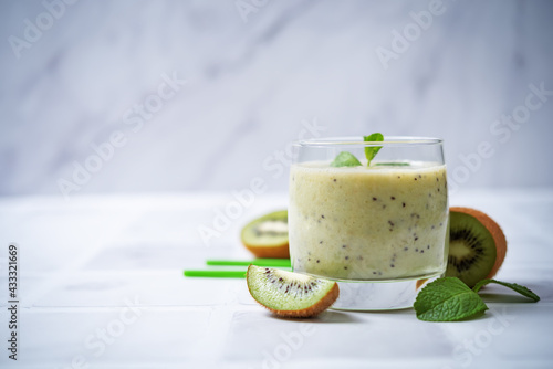 Kiwi banana smoothie in a glass