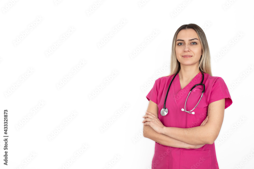 Nurse. Portrait on young woman nurse. medical student in her 20s wearing  pink scrubs and stethoscope. Isolated on white background. Stock Photo