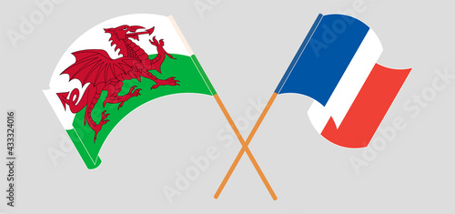 Crossed and waving flags of Wales and France